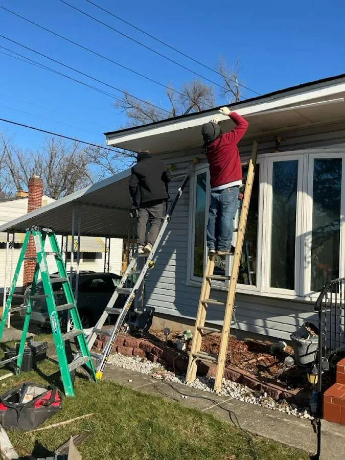 Restoration crew performing exterior repair in West Dundee